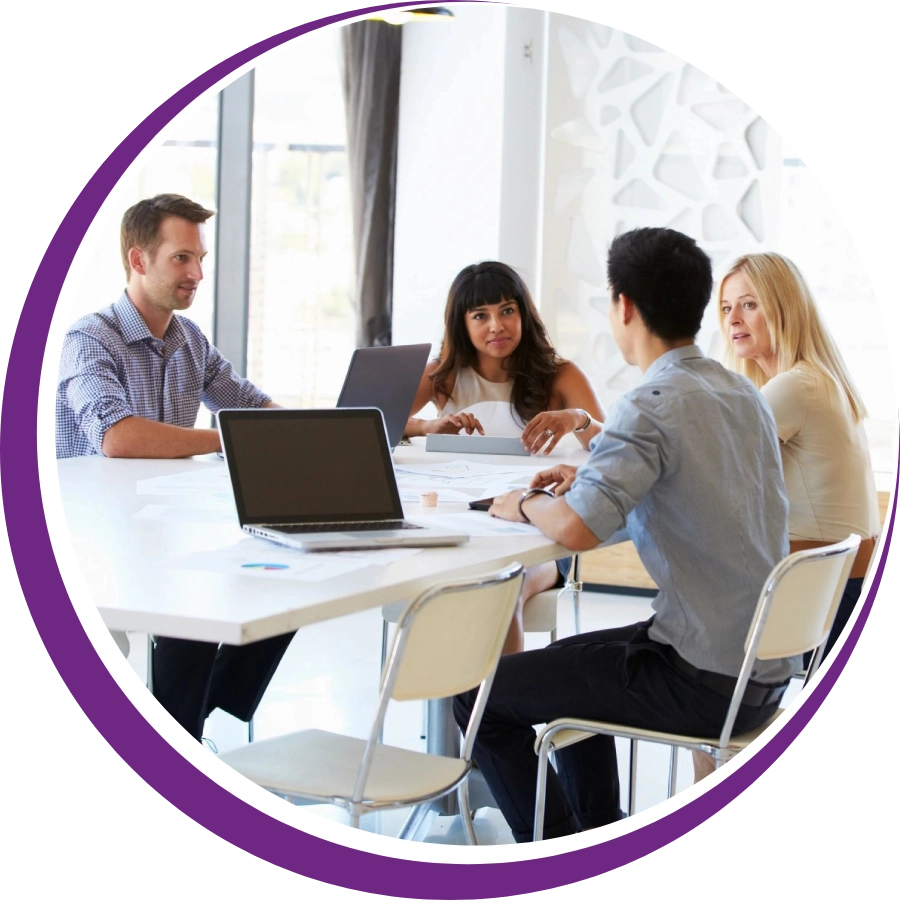 A group of people sitting around a table.